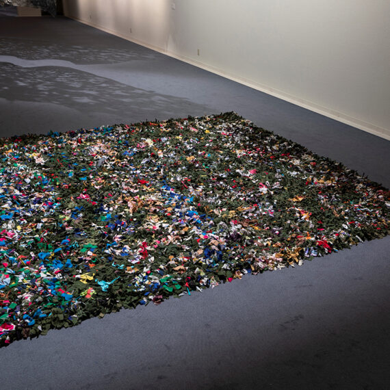 Reynier Leyva Novo b. 1983, Cuba Untitled (Militares y Civiles), 2018 Rug made by 12 unemployed civilians from Párraga, La Habana, from clothes used by military and civilians in Cuba 150 × 150 inches