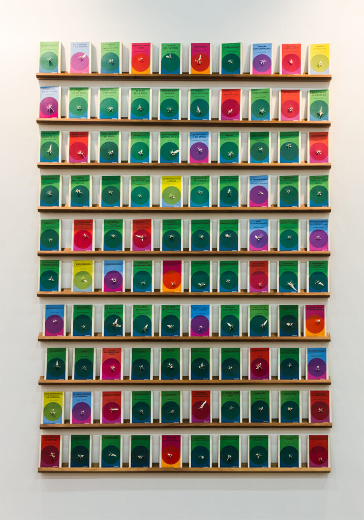 Gonzalo Lebrija b. 1972, Mexico Libros baleados, 2015 100 shot books on shelves 71⁄4 × 5 inches (each)