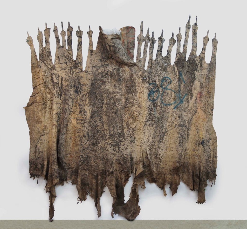 Eddie Rodolfo Aparicio b. 1990, United States Aquellos que apuntan con el dedo medio (11th and Union Streets, Los Angeles, California), 2017 Rubber, sulfur, resin, tree residue, and paint residue on cotton 102 × 180 × 6 inches