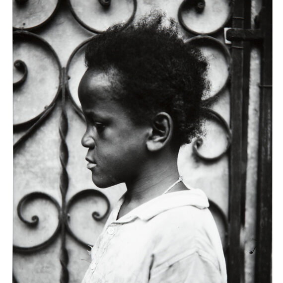 Walker Evans b. 1903, d. 1975, United States Child in Profile Before Iron Gate, Havana, 1933, 1969–70 Gelatin silver print 8 3⁄8 × 6 1⁄2 inches