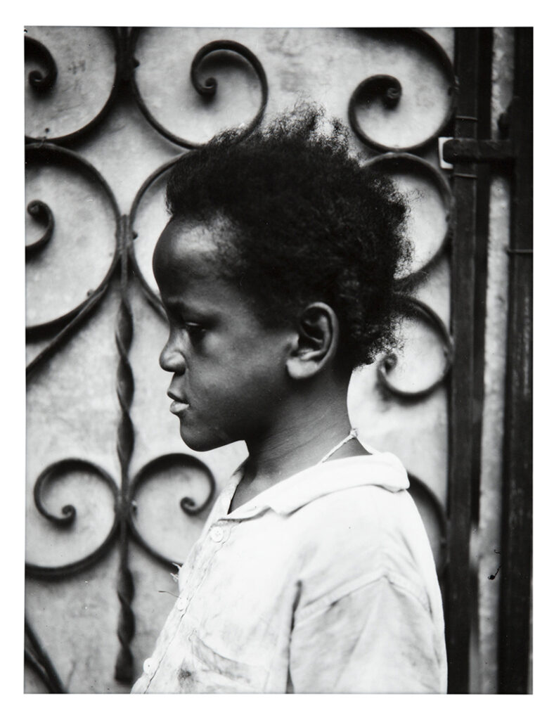 Walker Evans b. 1903, d. 1975, United States Child in Profile Before Iron Gate, Havana, 1933, 1969–70 Gelatin silver print 8 3⁄8 × 6 1⁄2 inches