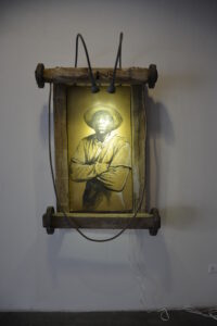 José A. Toirac and Octavio Marín b. 1966, b. 1963, Cuba Ricardo (Carretillero), 2016 Charcoal on cardboard, wood, metal, and lights Dimensions variable