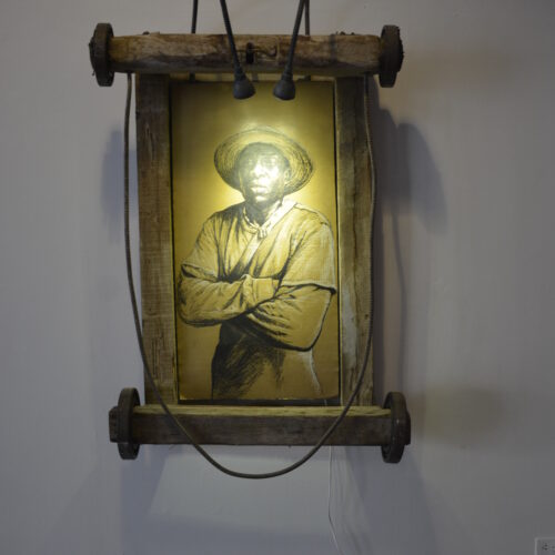 José A. Toirac and Octavio Marín b. 1966, b. 1963, Cuba Ricardo (Carretillero), 2016 Charcoal on cardboard, wood, metal, and lights Dimensions variable