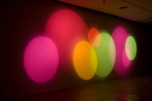 Karina Peisajovich (b. 1966, Argentina) Máquina de hacer color, 2008 Halogen lamps, motor, color, filters, glass, and wood, suite of 8 movements