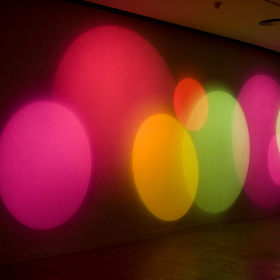 Karina Peisajovich (b. 1966, Argentina) Máquina de hacer color, 2008 Halogen lamps, motor, color, filters, glass, and wood, suite of 8 movements