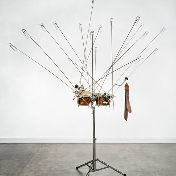 Abraham Cruzvillegas b. 1968, Mexico Topógrafos, 2003 Shot glasses, bongos, drum hardware, steel rods, Colombian pod, leather rattle, and cowbell 84 x 76 x 79 inches