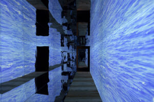 Graciela Sacco b. 1956, Argentina; d. 2017, Argentina Any exit can be a closure from the series Tensión admisible, 2013 Video installation, metal structure, mirrors, and rear projection 118.10 x 118.10 x 78.70 inches